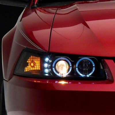 Raxiom 99-04 Ford Mustang Dual LED Halo Projector Headlights- Black Housing (Clear Lens)