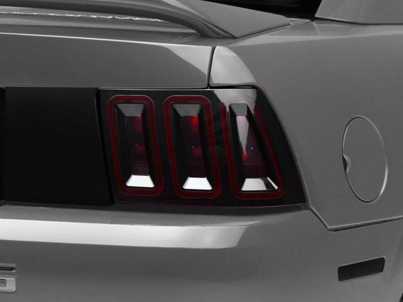 Raxiom 99-04 Ford Mustang Excluding 99-01 Cobra Icon LED Tail Lights- Black Housing (Smoked Lens) Raxiom 99-04 Ford Mustang Excluding 99-01 Cobra Icon LED Tail Lights- Black Housing (Smoked Lens)