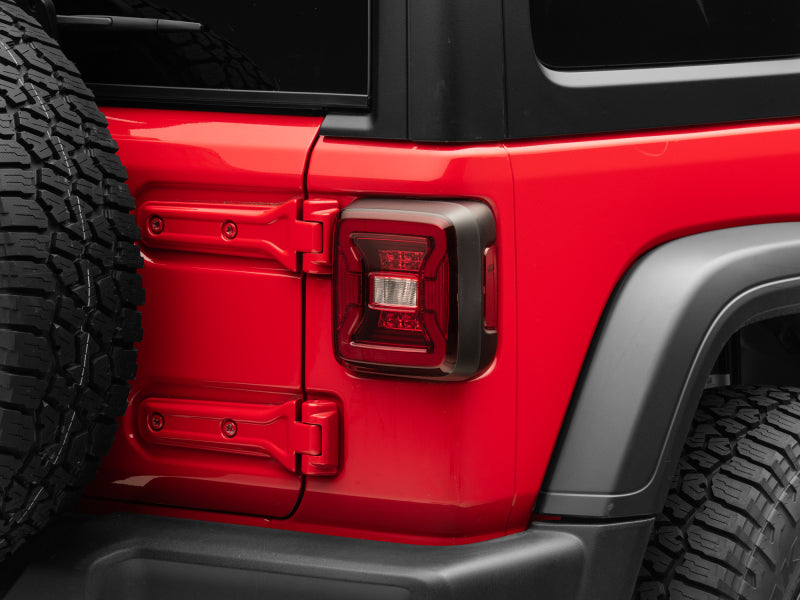 Raxiom 18-22 Jeep Wrangler JL LED Tail Lights- Black Housing - Red Lens Raxiom 18-22 Jeep Wrangler JL LED Tail Lights- Black Housing - Red Lens