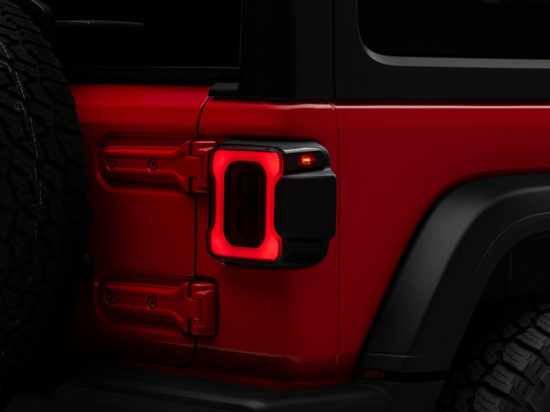 Raxiom 18-23 Jeep Wrangler JL Axial Series Carver LED Tail Lights- Blk Housing (Smoked Lens) Raxiom 18-23 Jeep Wrangler JL Axial Series Carver LED Tail Lights- Blk Housing (Smoked Lens)
