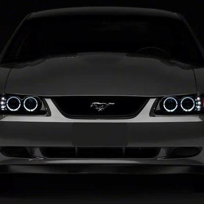 Raxiom 99-04 Ford Mustang Dual LED Halo Projector Headlights- Black Housing (Smoked Lens)