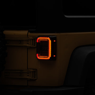 Raxiom 07-18 Jeep Wrangler JK Axial Series LED Halo Tail Lights- Black Housing (Dark Smoked Lens)