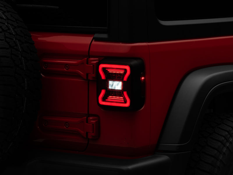 Raxiom 18-22 Jeep Wrangler JL LED Tail Lights- Black Housing - Red Lens Raxiom 18-22 Jeep Wrangler JL LED Tail Lights- Black Housing - Red Lens