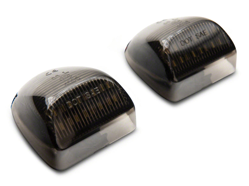 Raxiom 01-13 Chevrolet Silverado/GMC Sierra 1500 Axial Series LED License Plate Lamps- Smoked Raxiom 01-13 Chevrolet Silverado/GMC Sierra 1500 Axial Series LED License Plate Lamps- Smoked