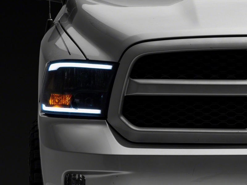 Raxiom 09-18 Dodge RAM 1500/2500/3500 Axial Series Headlights w/ LED Bar- Blk Housing (Clear Lens) Raxiom 09-18 Dodge RAM 1500/2500/3500 Axial Series Headlights w/ LED Bar- Blk Housing (Clear Lens)