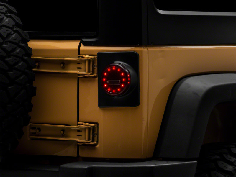 Raxiom 07-18 Jeep Wrangler JK Axial Series Halo LED Tail Lights- Blk Housing (Clear Lens) Raxiom 07-18 Jeep Wrangler JK Axial Series Halo LED Tail Lights- Blk Housing (Clear Lens)