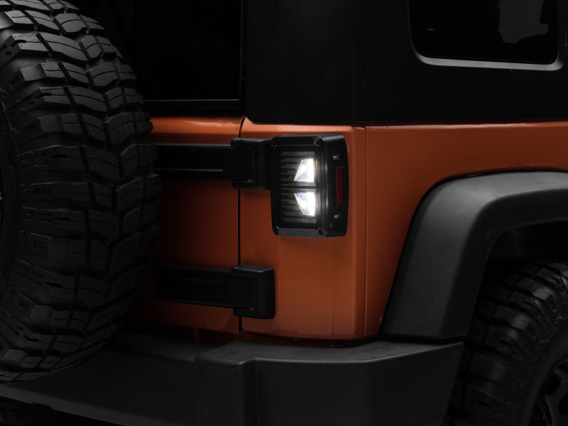 Raxiom 07-18 Jeep Wrangler JK Axial Series Vision LED Tail Lights- Black Housing (Smoked Lens) Raxiom 07-18 Jeep Wrangler JK Axial Series Vision LED Tail Lights- Black Housing (Smoked Lens)