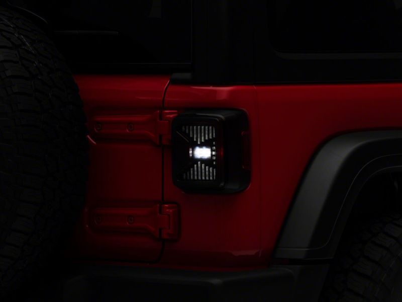 Raxiom 18-23 Jeep Wrangler JL LED Tail Lights- Blk Housing (Smoked Lens) Raxiom 18-23 Jeep Wrangler JL LED Tail Lights- Blk Housing (Smoked Lens)