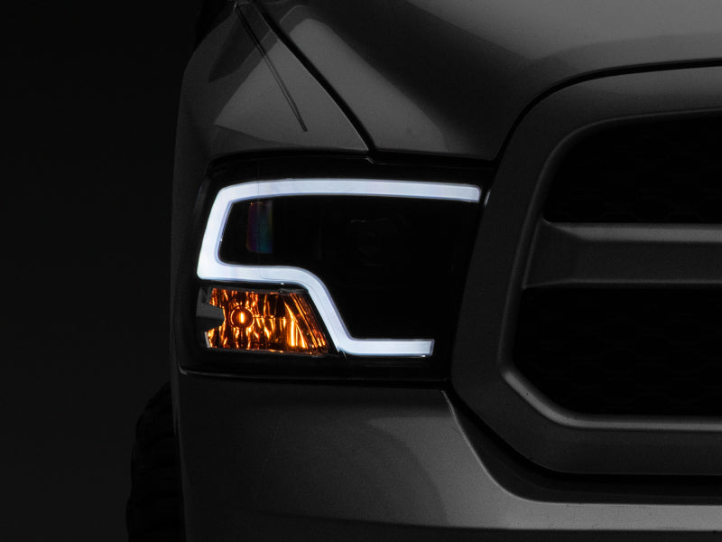 Raxiom 09-18 RAM 1500 LED Halo Projector Headlights- Black Housing (Clear Lens) Raxiom 09-18 RAM 1500 LED Halo Projector Headlights- Black Housing (Clear Lens)