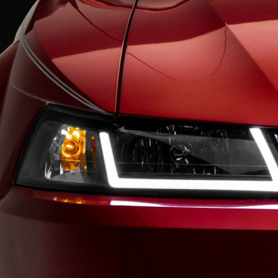 Raxiom 99-04 Ford Mustang Axial Series Headlights w/ LED Bar- Blk Housing (Clear Lens)