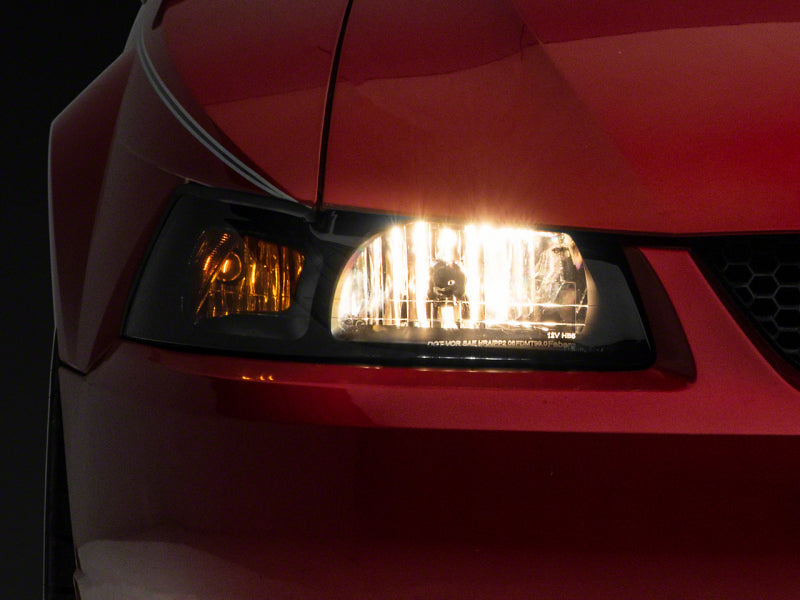 Raxiom 99-04 Ford Mustang Axial Series OEM Style Replacement Headlights- Blk Housing (Smoked Lens) Raxiom 99-04 Ford Mustang Axial Series OEM Style Replacement Headlights- Blk Housing (Smoked Lens)