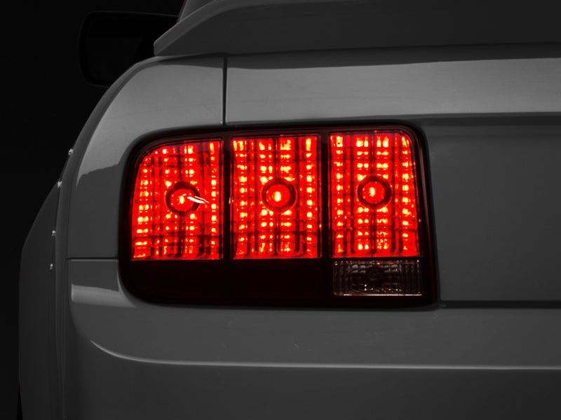 Raxiom 05-09 Ford Mustang Tail Lights- Black Housing (Smoked Lens) Raxiom 05-09 Ford Mustang Tail Lights- Black Housing (Smoked Lens)