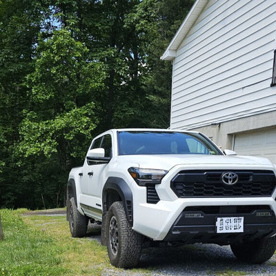 Rally Armor 24-25 Toyota Tacoma Gen 4 Black UR Mud Flap w/White Logo