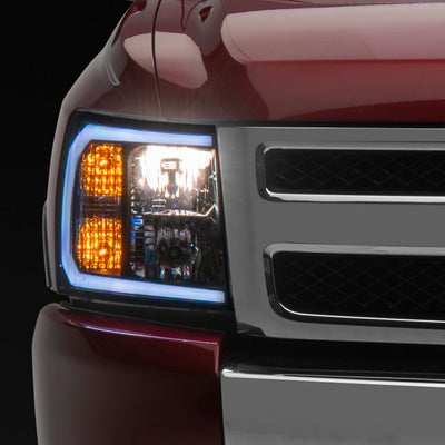 Raxiom 07-13 Chevrolet Silverado 1500 Axial Headlights w/ SEQL LED Bar- Blk Housing (Clear Lens)