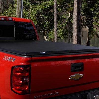 Lund 04-15 Nissan Titan (5.5ft. Bed) Hard Fold Tonneau Cover w/Bracket Kit - Black
