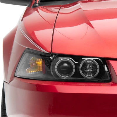 Raxiom 99-04 Ford Mustang Dual LED Halo Projector Headlights- Black Housing (Clear Lens)