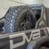 DV8 Offroad 2019+ Jeep Gladiator Universal Stand Up In-Bed Tire Carrier