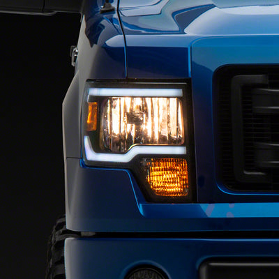 Raxiom 09-14 Ford F-150 Axial Series Headlight w/ SEQL LED Bar- Blk Housing (Clear Lens)