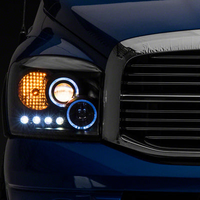 Raxiom 06-08 Dodge RAM 1500 LED Halo Projector Headlights- Blk Housing (Clear Lens)