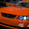 Raxiom 99-04 Ford Mustang Dual LED Halo Projector Headlights- Black Housing (Clear Lens)