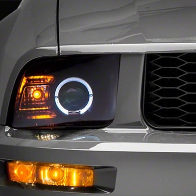 Raxiom 05-09 Ford Mustang Halogen 2010 Style LED Halo Headlights-Blk Hsng(Clear Lens/Excludes GT500)