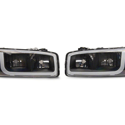 Raxiom 99-06 GMC Sierra 1500 Axial Series Headlights w/ LED Bar- Blk Housing (Clear Lens)