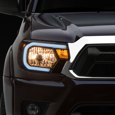 Raxiom 12-15 Toyota Tacoma Axial Series Headlights w/ LED Bar- Blk Housing (Clear Lens)
