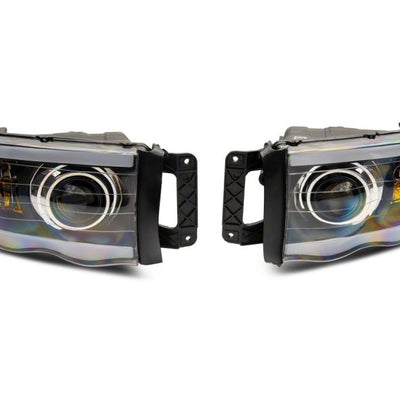 Raxiom 02-05 Dodge RAM 1500 LED Projector Headlights w/ SEQL LED Bar- Blk Housing (Clear Lens)