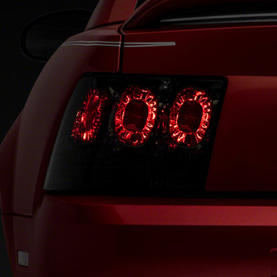 Raxiom 99-04 Ford Mustang Axial Series Altezza Style Tail Lights- Blk Housing (Smoked Lens)