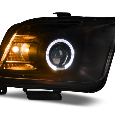 Raxiom 05-09 Ford Mustang Halogen 2010 Style LED Halo Headlights-Blk Hsng(Clear Lens/Excludes GT500)