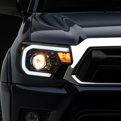 Raxiom 12-15 Toyota Tacoma Axial Series Projector Headlights w/ LED Bar- Blk Housing (Clear Lens)