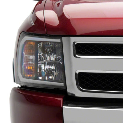 Raxiom 07-13 Chevrolet Silverado 1500 Axial Headlights w/ SEQL LED Bar- Blk Housing (Clear Lens)